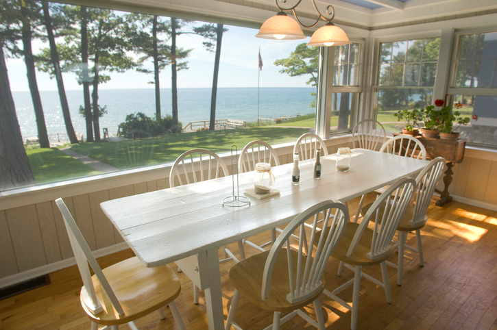 Summer cottage on the lake with chairs