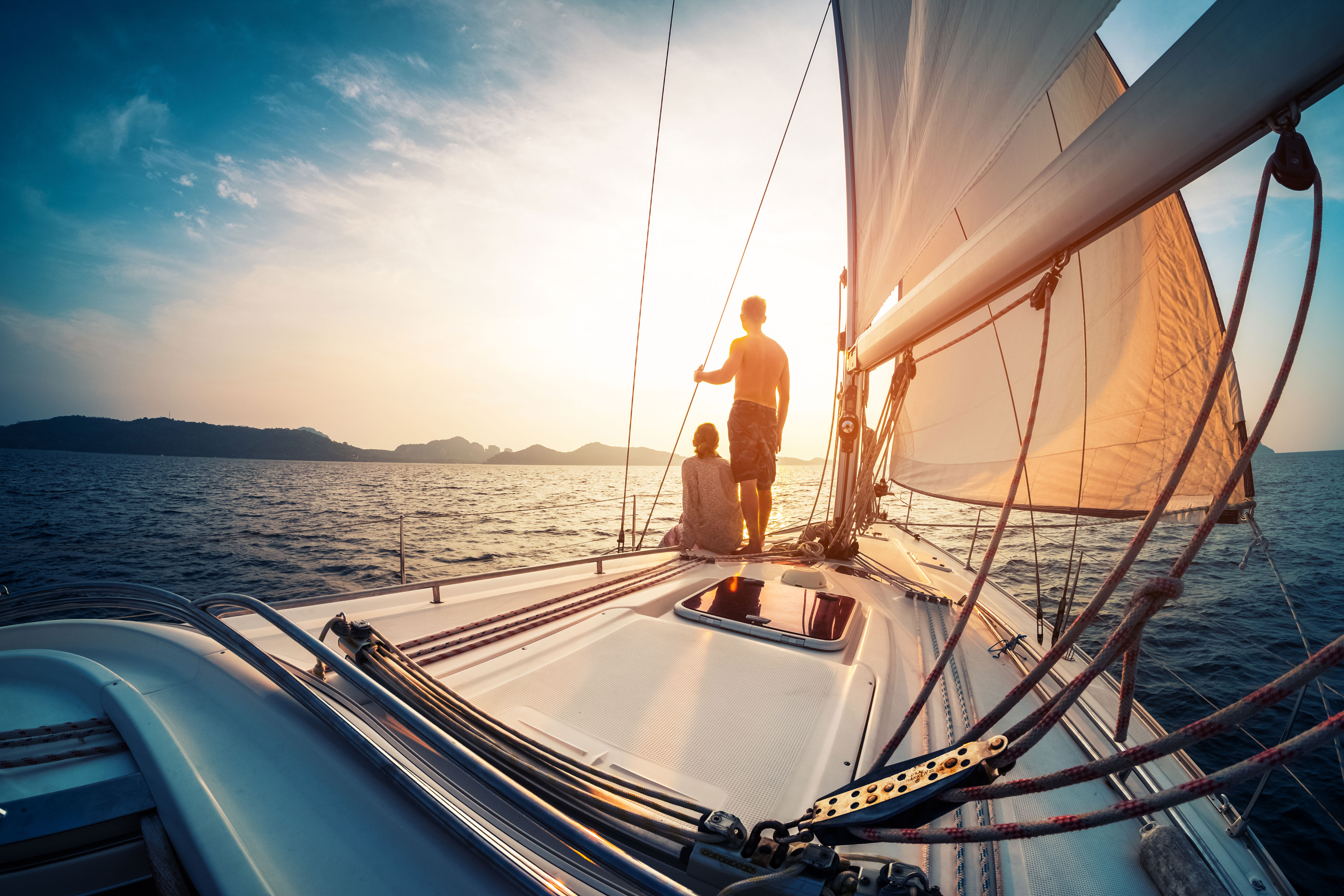 couple enjoying sunset from the sail boat at Smith Mountain Lake