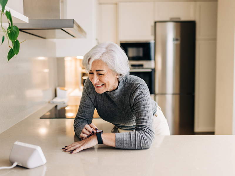 middle age woman smiling on the countertop